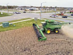 Farming equipment tilling a field