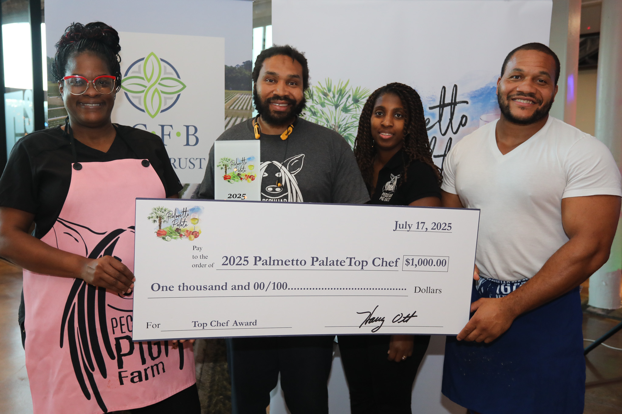 Peculiar Pig team with award