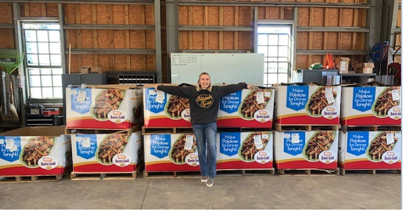 Woman posing with donated goods