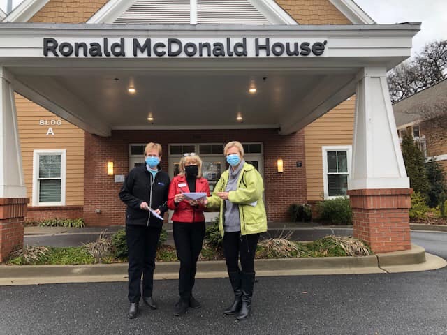 Women posing in front of Ronald McDonald House