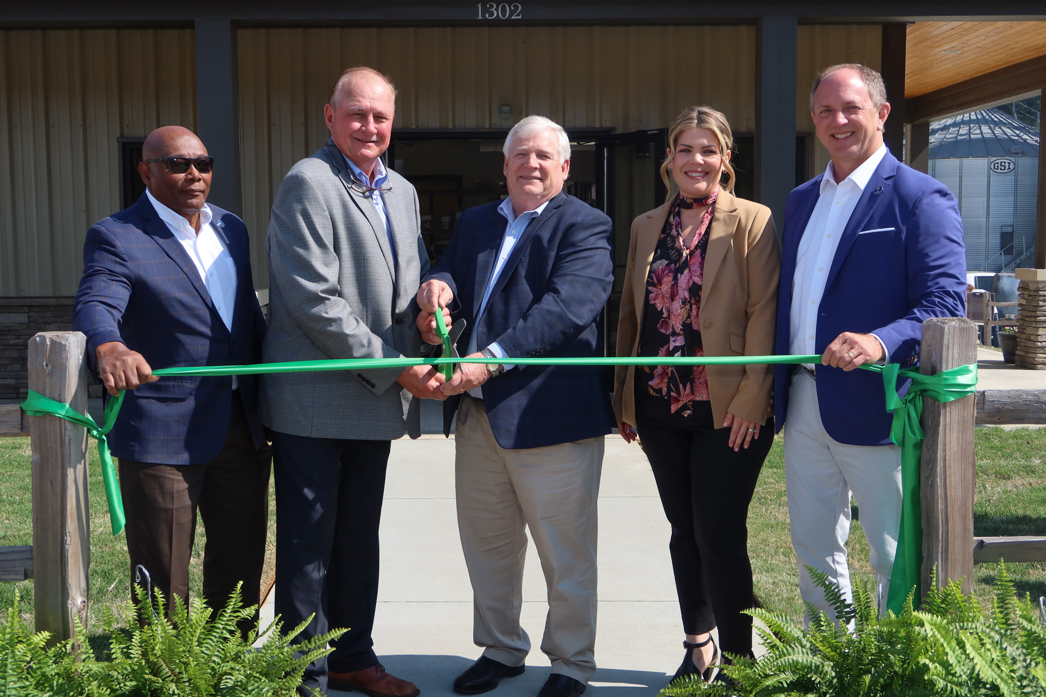 (L to R) Glenn Davis, Anderson County Council; Tommy Dunn, Anderson County Council Chairman; Harry Ott, SCFB President; Anna Artman, Anderson County Principal Finance Analyst; and Chris Sullivan, Anderson County Council prepare to cut the ribbon to officially commemorate the grand opening of the newly expanded South Carolina Farm Bureau Grain Elevator in Anderson.