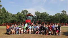 teachers in front of tractor