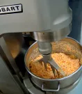 Industrial mixer blending ingredients