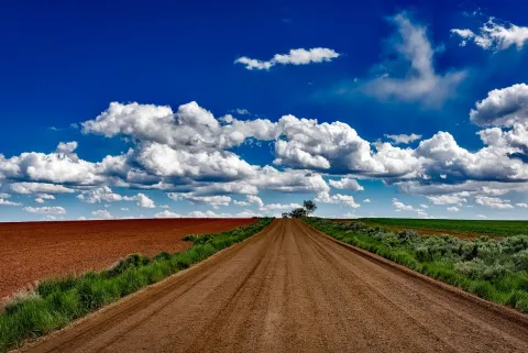 Farm road and sky