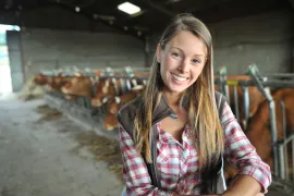 Young girl in barn. 