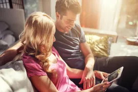 Couple looking at a tablet